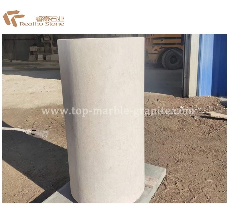 Beige travertine column
